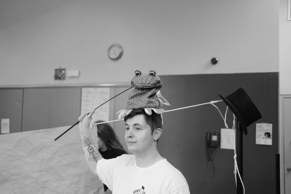 Photo by Romina Hytten Puppet frog sat on top of puppeteer's head